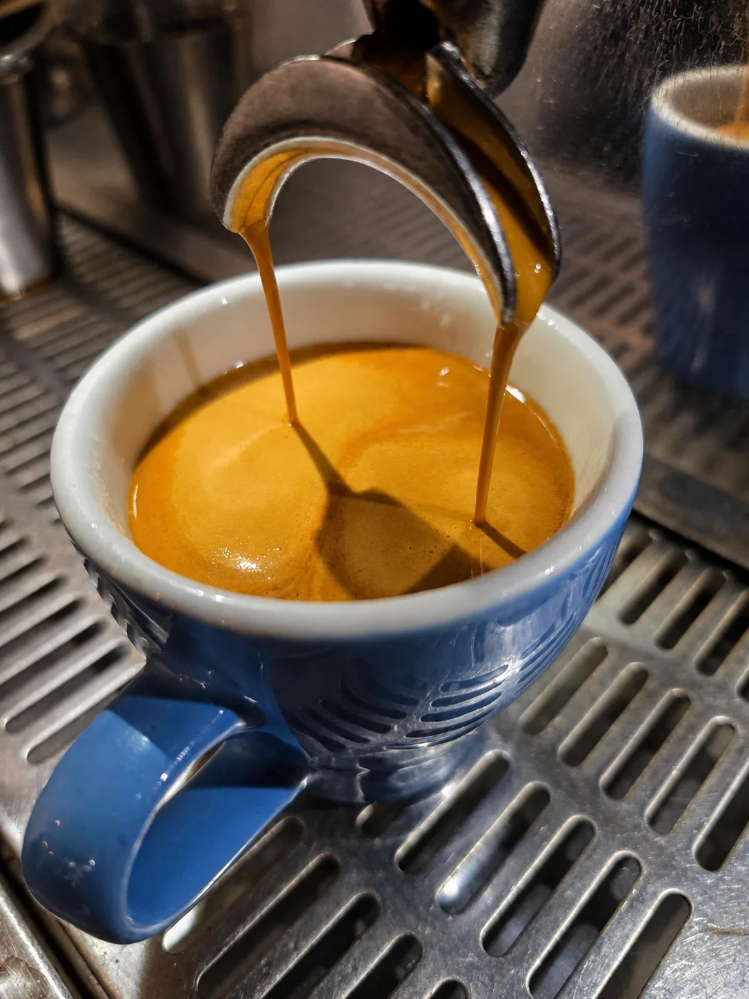 Espresso pouring into a cup at eightyeight Cafe