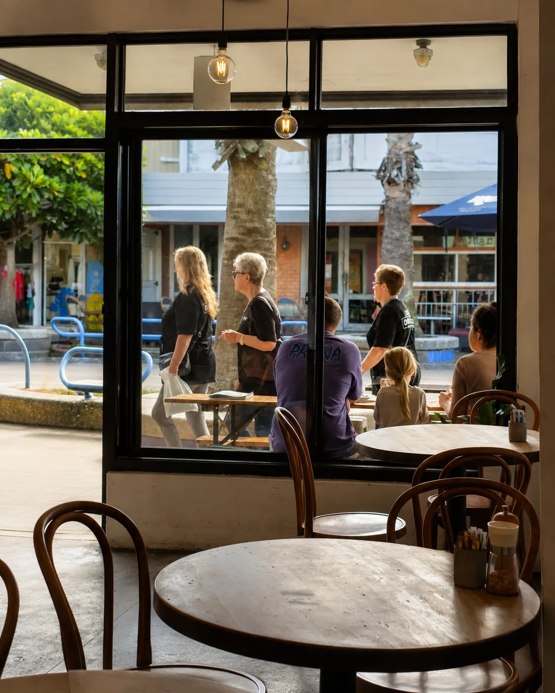 Indoor cafe seating looking onto Maunganui Road